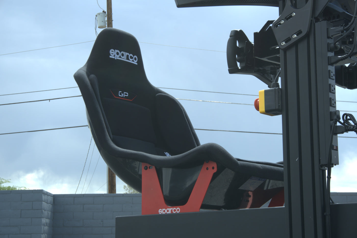 Professional technicians installing Formula racing simulator