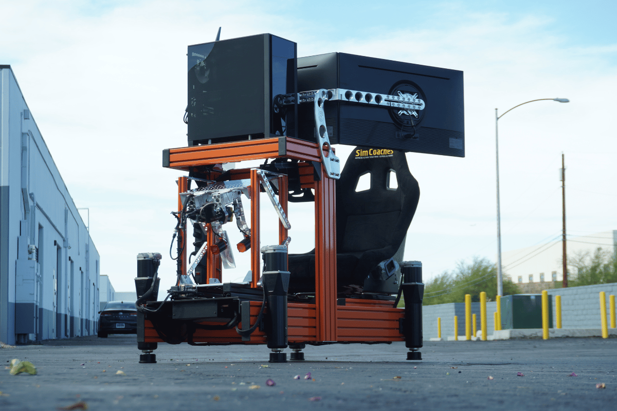 Omega 3DOF motion racing simulator with hydraulic platform featuring vertical heave pitch and roll movements