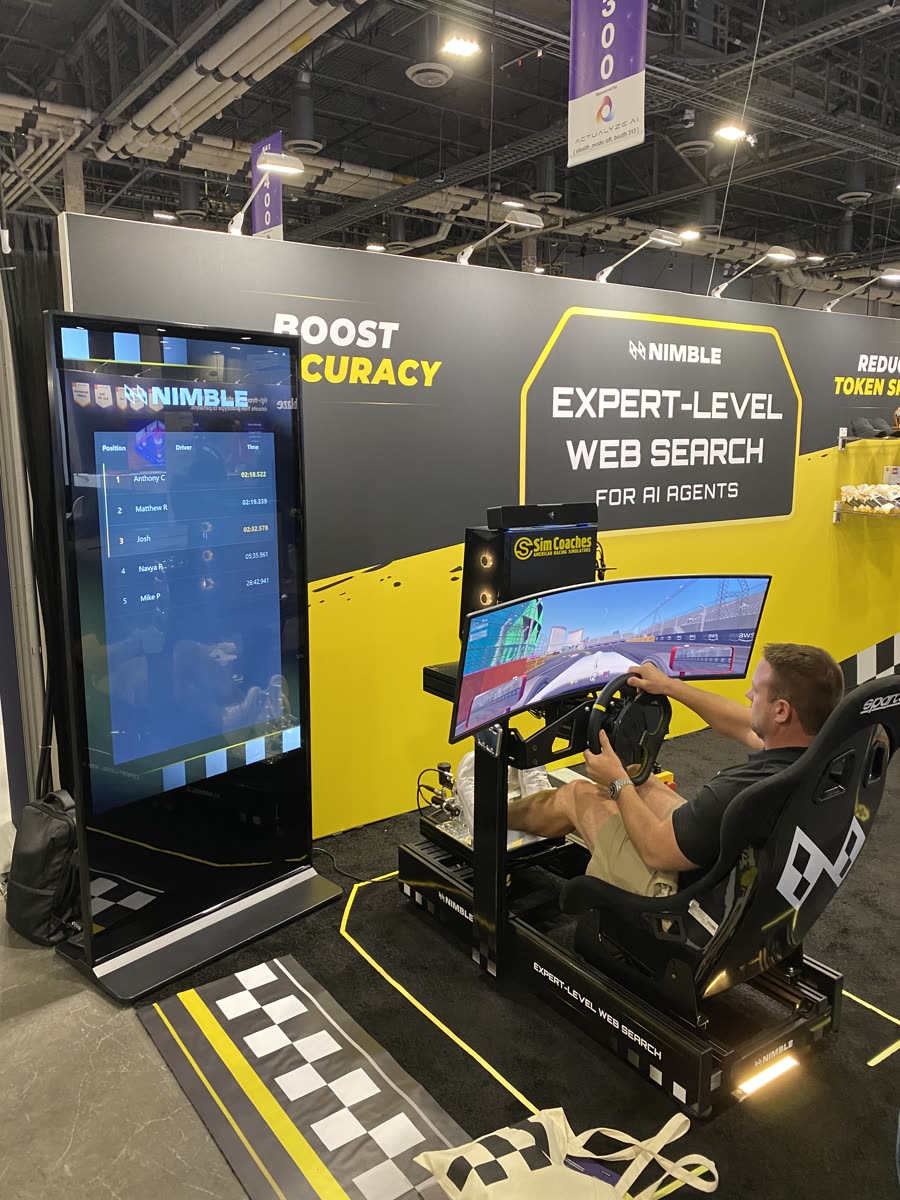 Sim Coaches racing simulator with branded wrap and leaderboard at the Nimble trade show booth