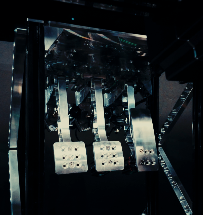 Sim Coaches Inverted Hydraulic Pedals on Omega racing simulator cockpit